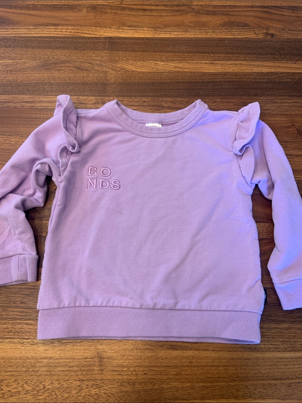 Bonds Girls Lavender Ruffle Shoulder Sweatshirt 18-24M - Like New
